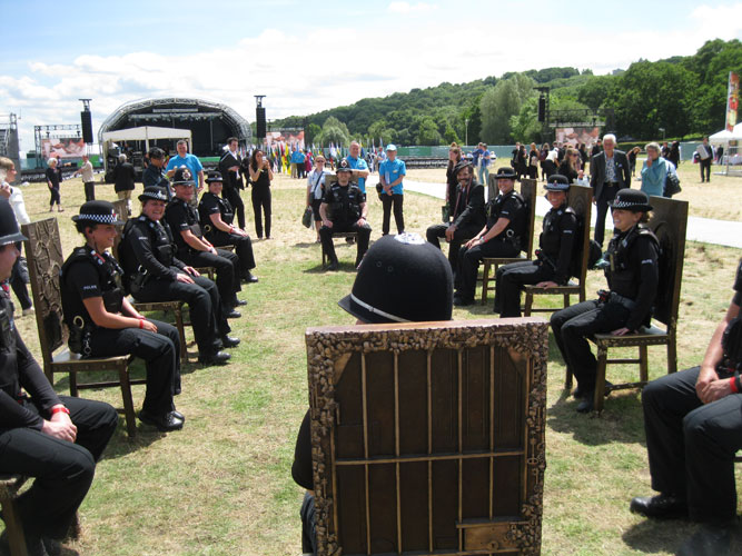 police officers try out The Jurors by Hew Locke